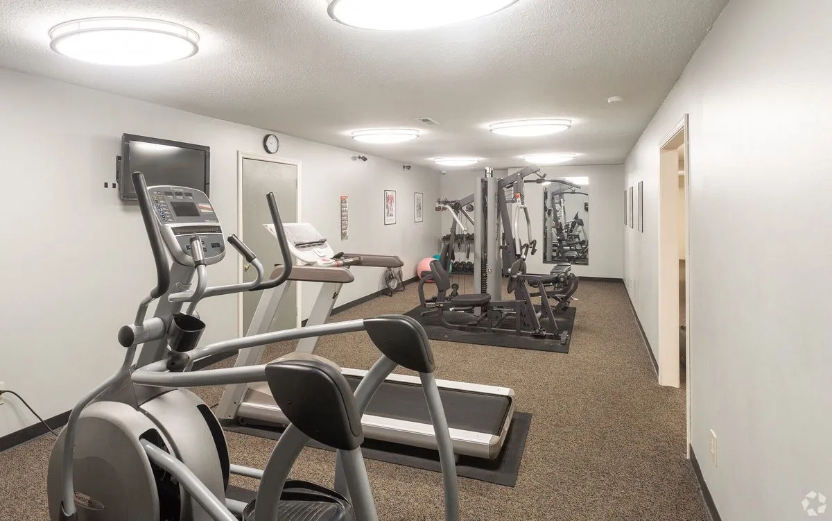 24-hour fitness center with treadmill, elliptical and weight machine