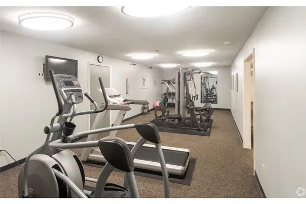24-hour fitness center with elliptical, treadmill and weight machine